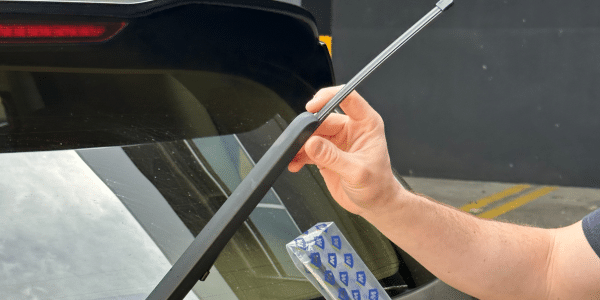 Person easily swapping exact fit rear wiper blade